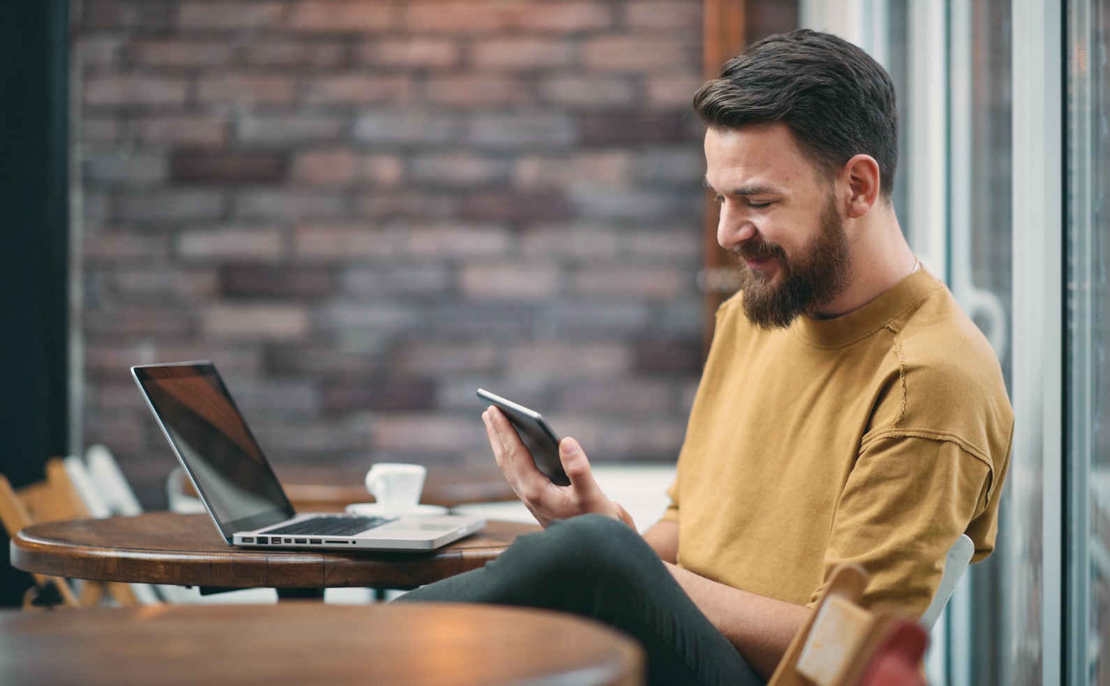 FINALyoung man sitting in cafeteria picture id925766076
