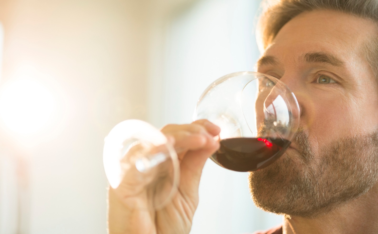 FINALman enjoying a glass of red wine picture id466556845