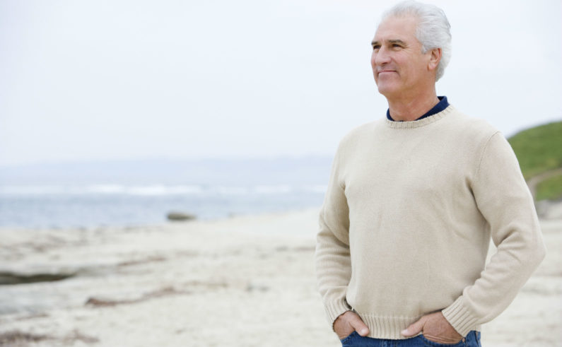 Man at the beach with hands in pockets final