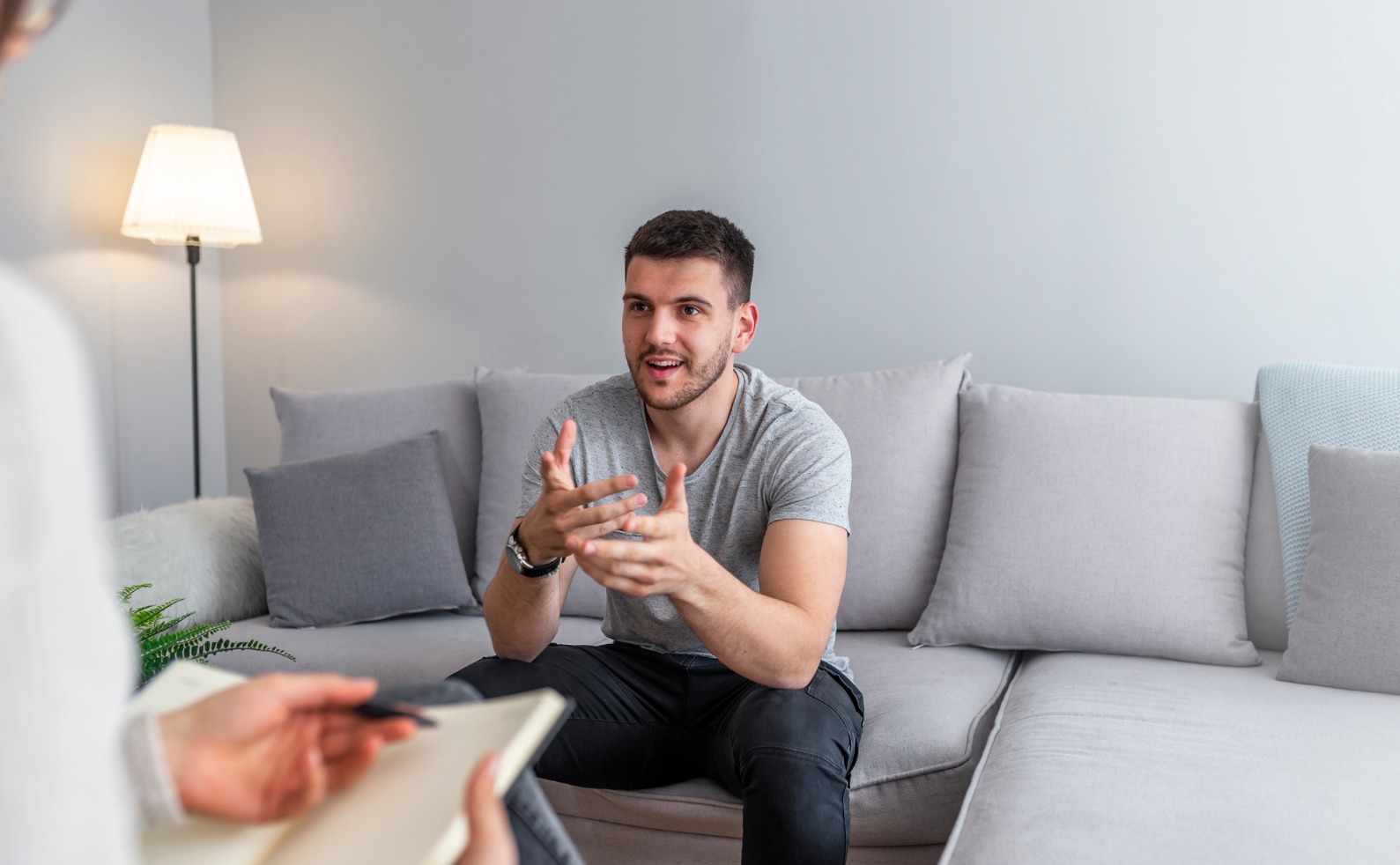 psychologist talking with happy man in the office picture id1144415174